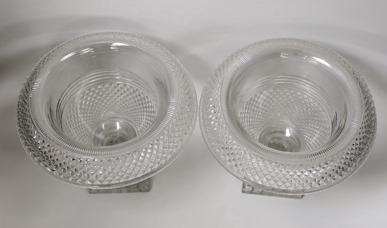 A pair of Georgian cut glass turnover rim pedestal dishes, 22cm tall